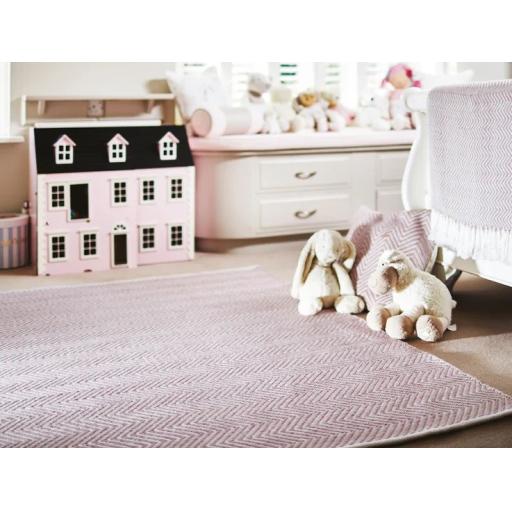 Hug Rug Woven Washable Reversible Herringbone Outdoor Indoor Rug in Rose Pink